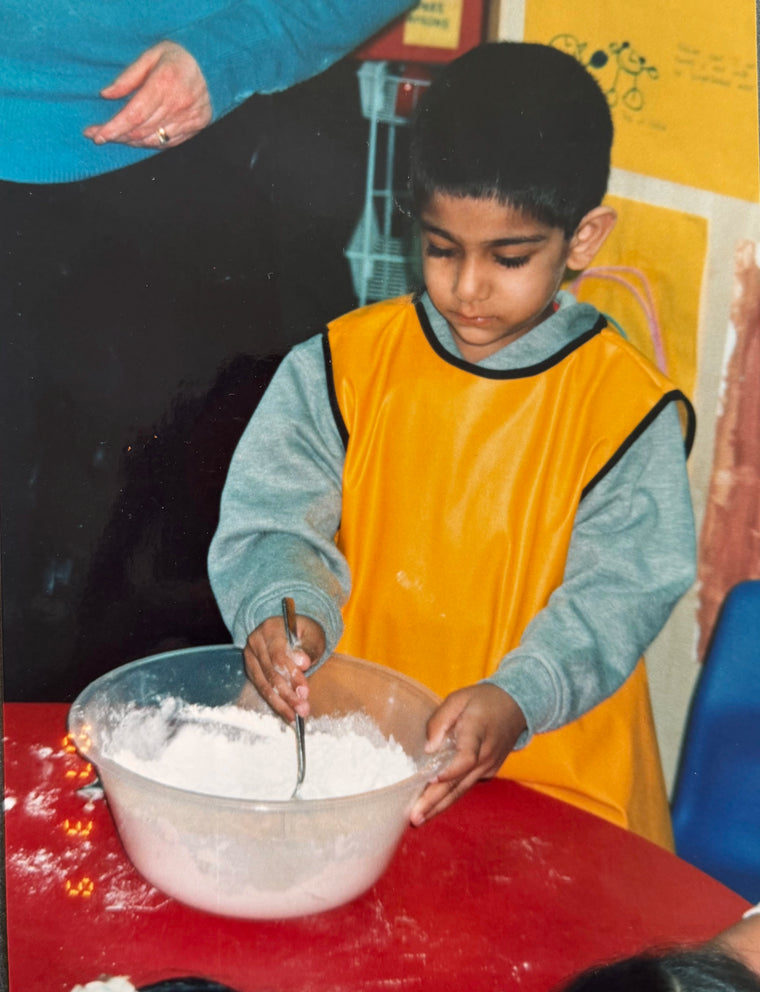 Feem in primary school whipping up his first bakes